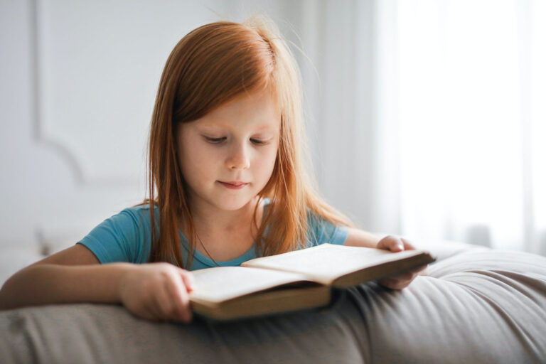 little red-haired girl reading book, dyslexia/psychoeducational testing, McKinney, TX